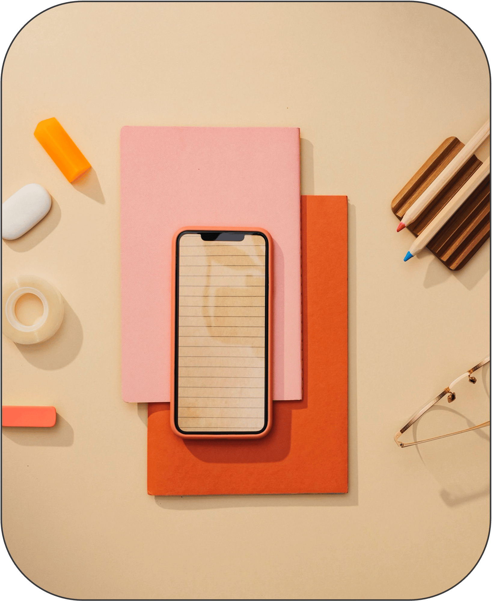 Flat lay of desk with pencils and notepad